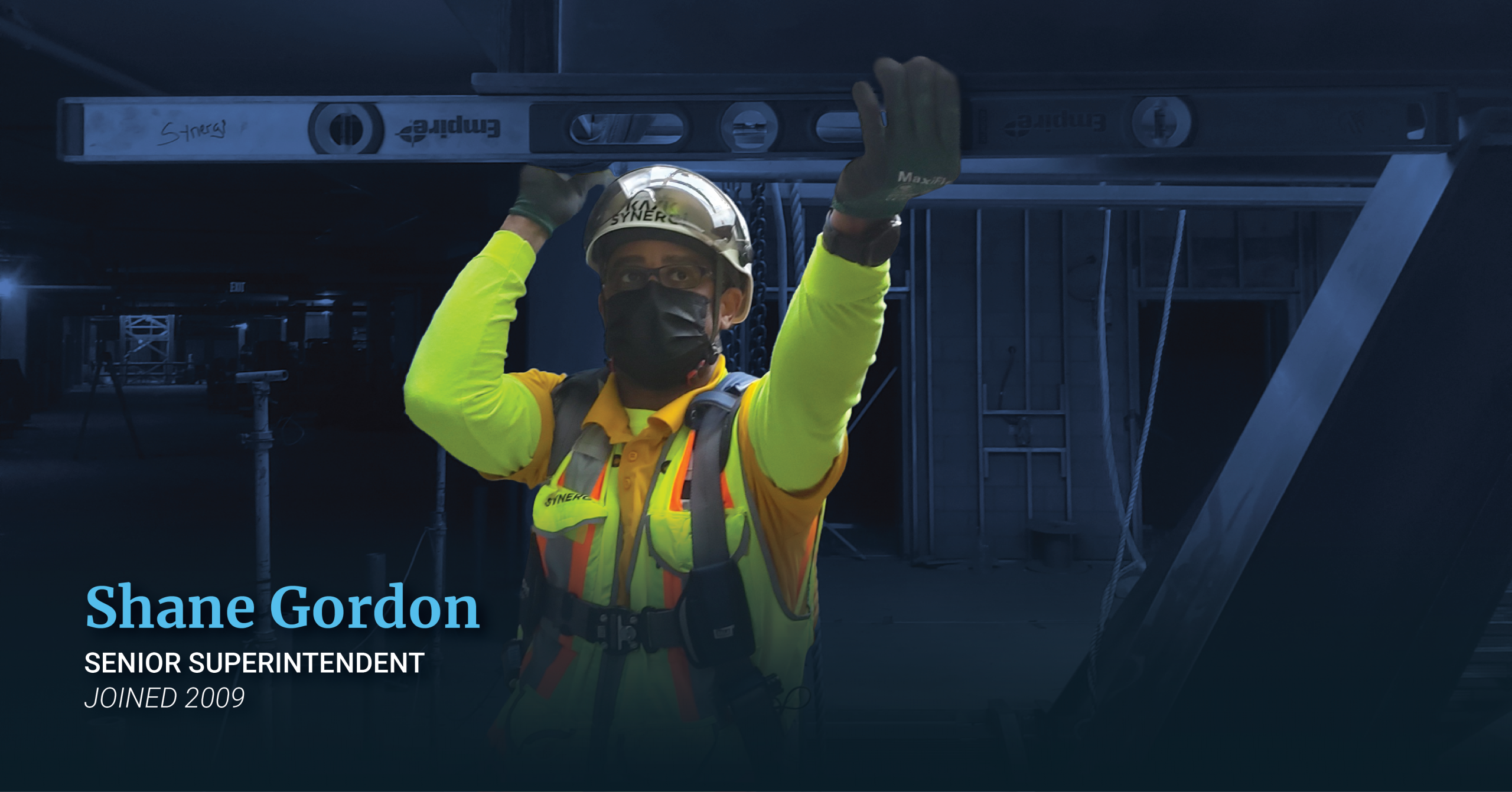 Man in personal protective equipment working on construction site.