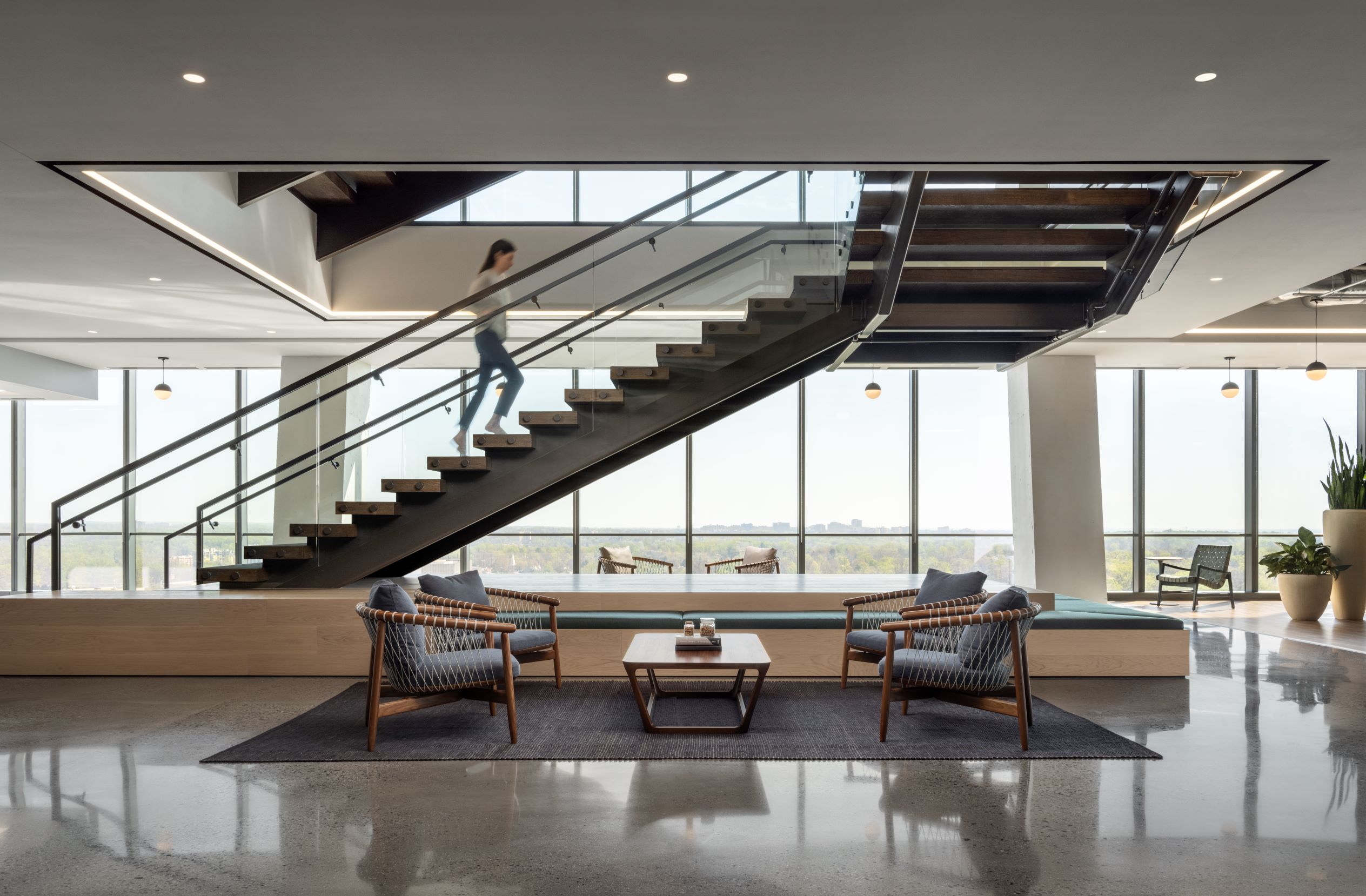 person walks up interconnecting feature stairs in enviva headquarters office