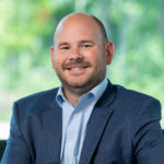 Headshot of Michael Christopher, Chief Financial Officer for Synergi