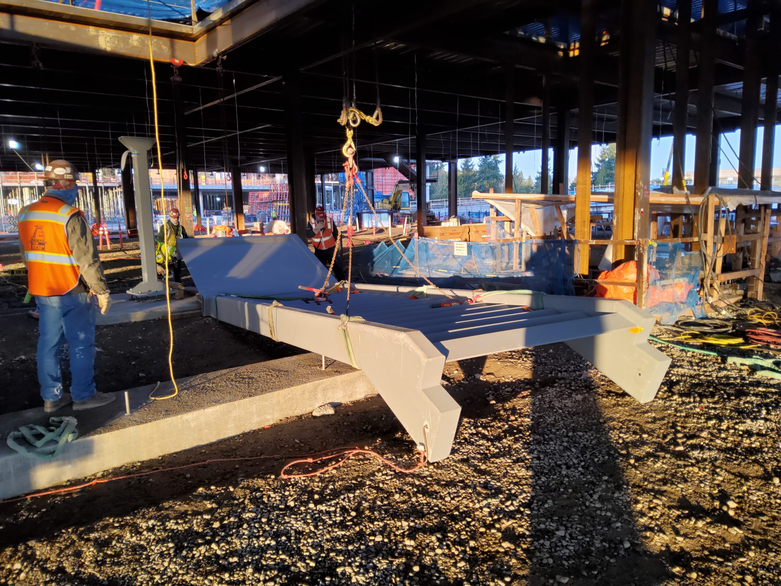 Sun shining on prefabricated modular feature stair with rigging attached on construction site